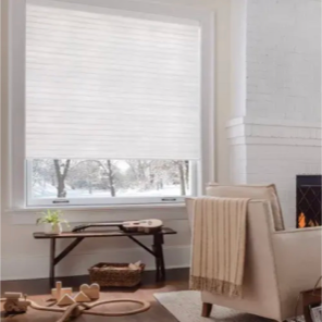 Light filtering cellular shades in a white room